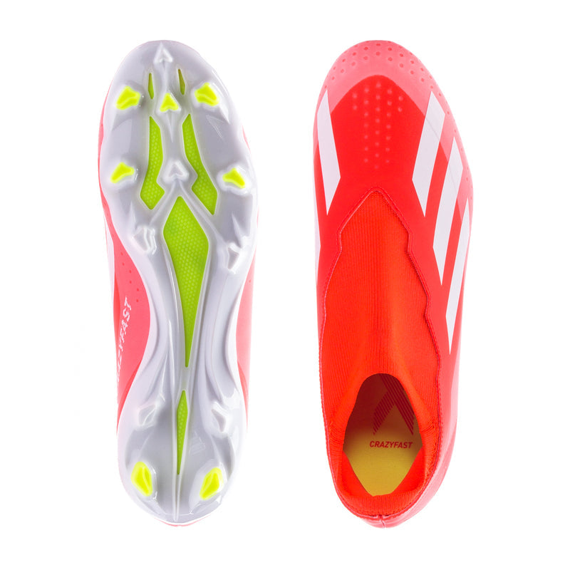 Soccer cleat pair soles: red uppers, white stripes, green stud pattern