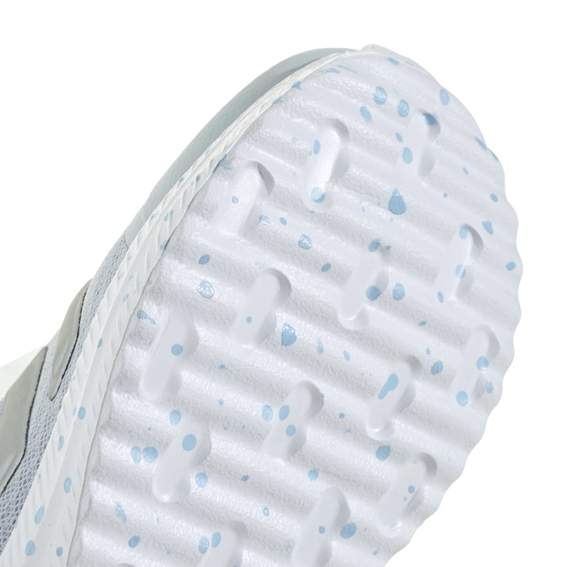 Kids sneaker outsole tread with light blue speckle pattern