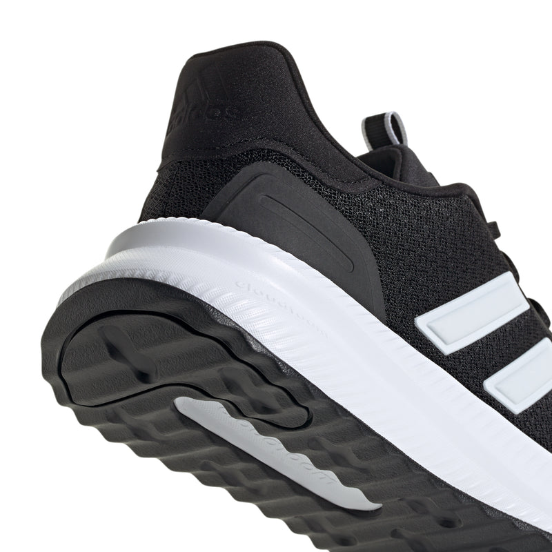 Side view of men's black adidas sneakers with white midsole and molded heel detail
