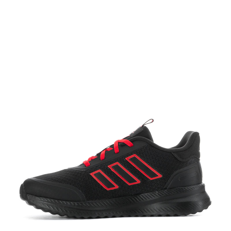 Youth black athletic shoe with ruby red lace accents and bold side stripe detail