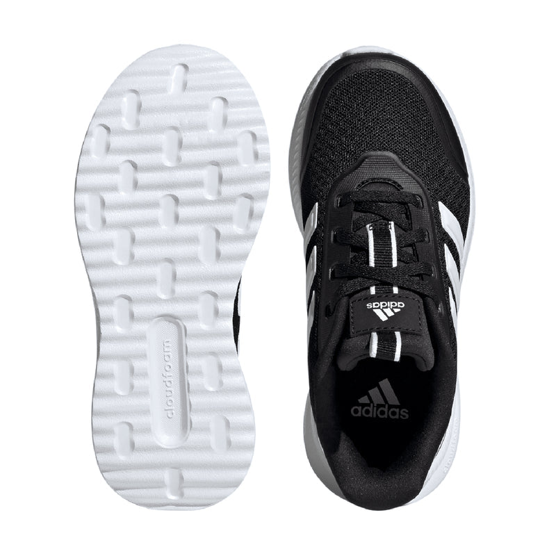 Youth sneakers showing treaded rubber outsole and black interior with adidas logo