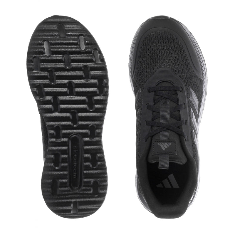 Youth black sneakers outsole tread and heel view, showing rubber traction