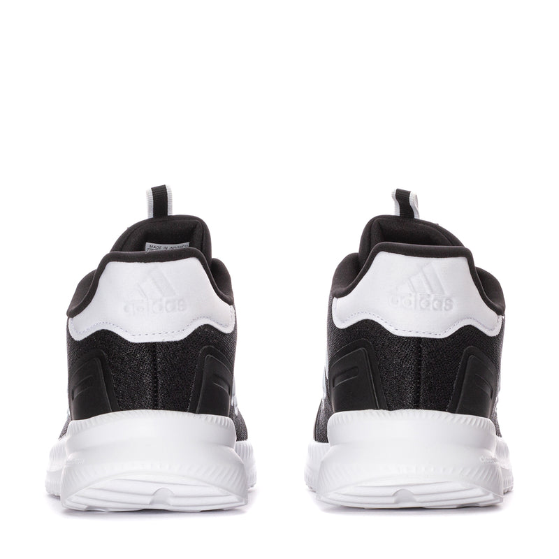 Back view of youth black sneakers with white heel panel and cushioned collar