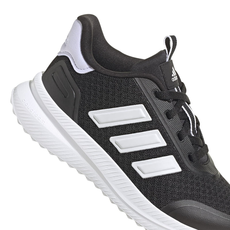 Close-up of youth black adidas lace-up sneaker with white stripe overlays and mesh