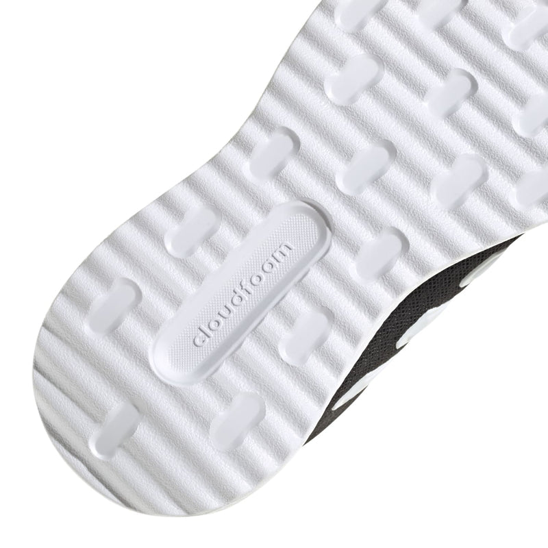 Close-up of youth sneaker outsole tread with adidas embossed text