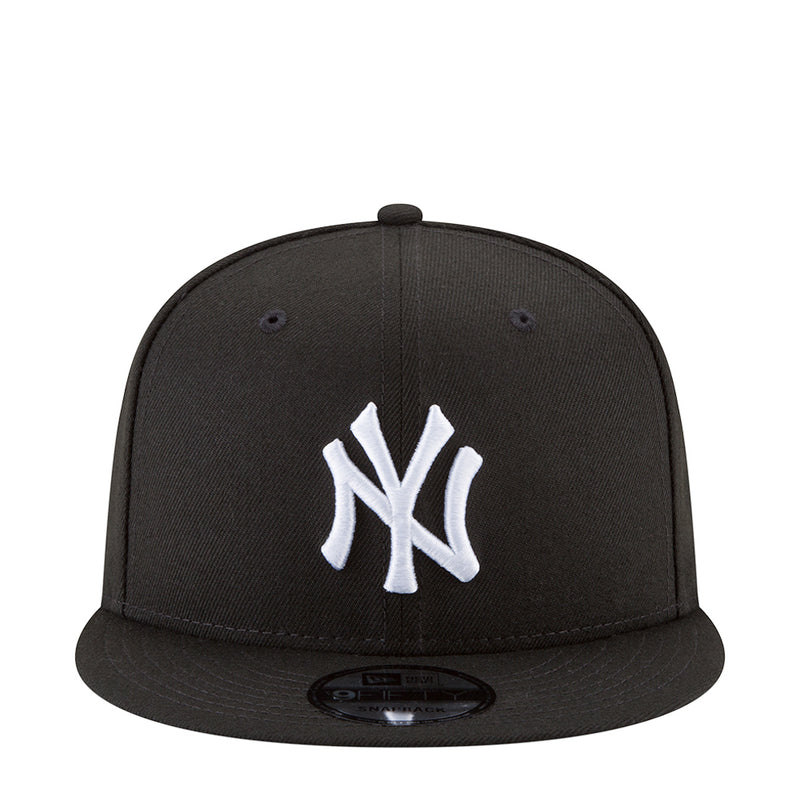 Black baseball cap with white NY Yankees logo on the front