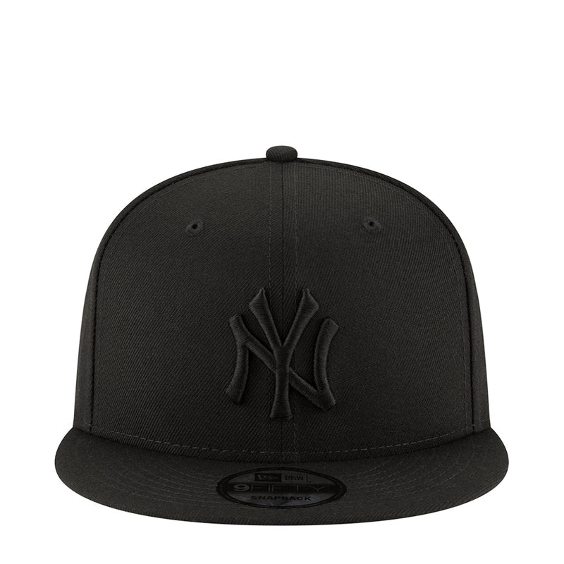 Black baseball cap with raised NY logo on the front and curved brim
