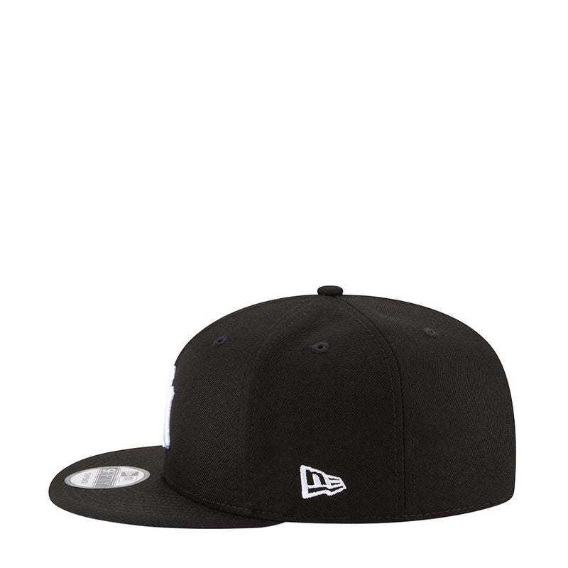 Black baseball cap with New Era logo patch on the side