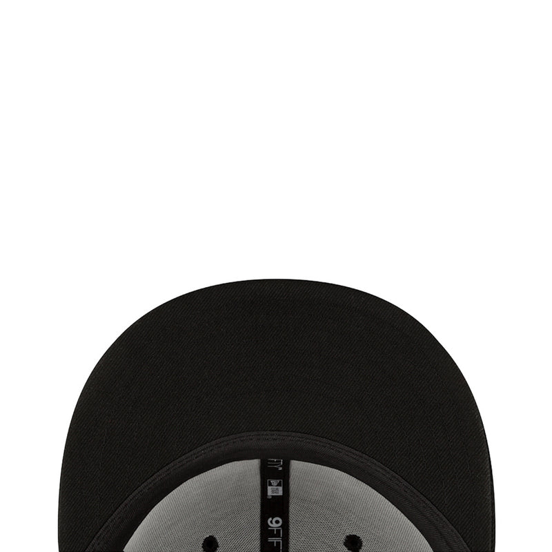 Baseball cap inner brim close-up with black fabric and stitched band