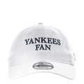 White baseball cap with Yankees Fan front logo and New Era patch