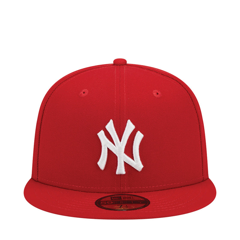 Red baseball cap with white NY Yankees logo on front