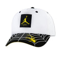 Youth snapback cap in white with black front Jumpman logo patch and yellow accents
