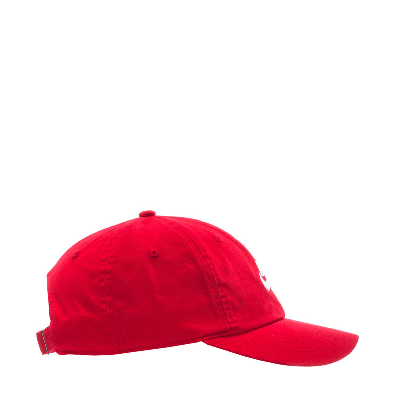 Youth red strapback cap, side view with small white Nike swoosh