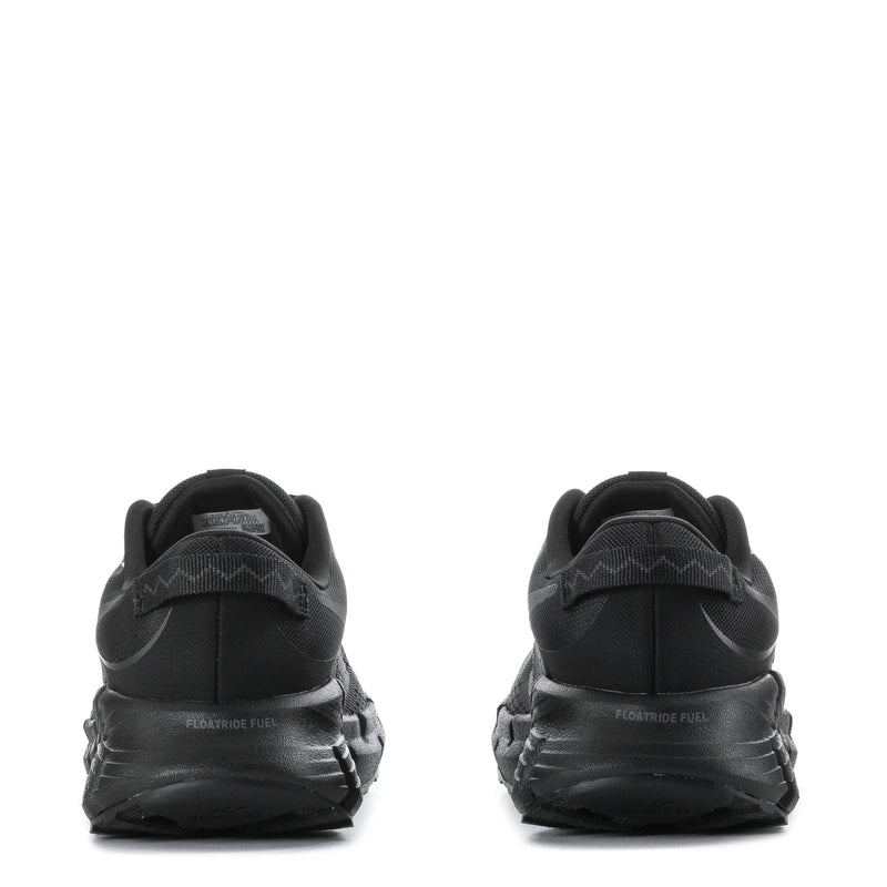 Black youth running shoes from heel view with padded collar and textured midsole