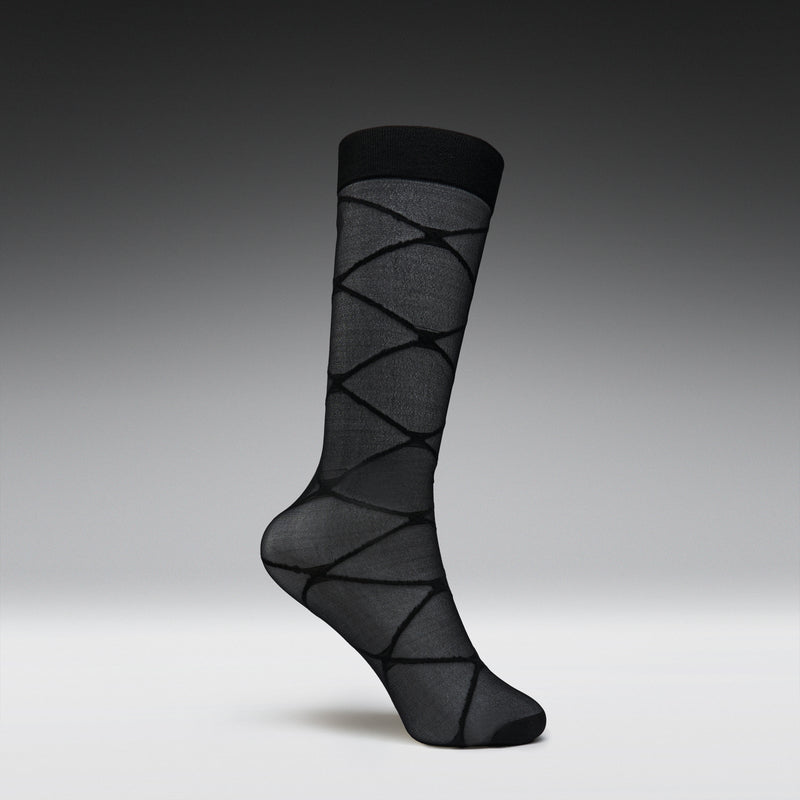 Black patterned sock on a gray background